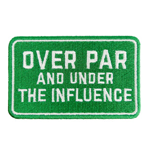 Green patch with white text 'OVER PAR AND UNDER THE INFLUENCE' on a white background