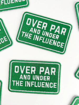 Green patches with text 'Over Par and Under the Influence' on a white background