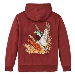 Brick red hoodie with male and female mallard ducks taking off from a patch of tan grass on the back