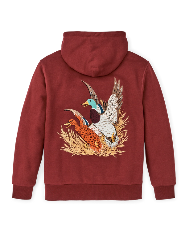 Brick red hoodie with male and female mallard ducks taking off from a patch of tan grass on the back