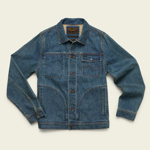 Blue denim jacket chore jacket depot jacket on a beige background howler bros