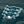Three blue and white fox-shaped car air fresheners on a blue background with the word 