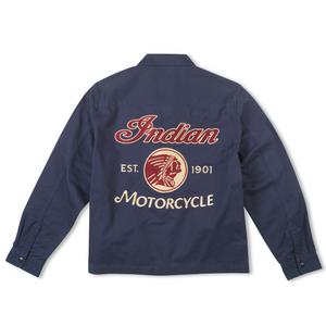 A navy blue long-sleeve work jacket shown from the back, featuring a large graphic print with 'Indian Motorcycle' in red and cream lettering, and a circular Native American head emblem in the center.