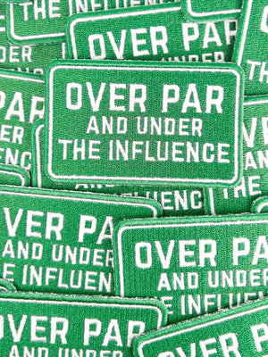 Green patches with white text 'OVER PAR AND UNDER THE INFLUENCE' arranged together.