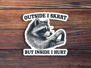 Outside I Skrrt Inside I Hurt Raccoon Sticker: Glossy