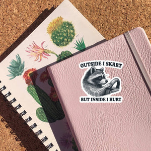 Outside I Skrrt Inside I Hurt Raccoon Sticker: Glossy